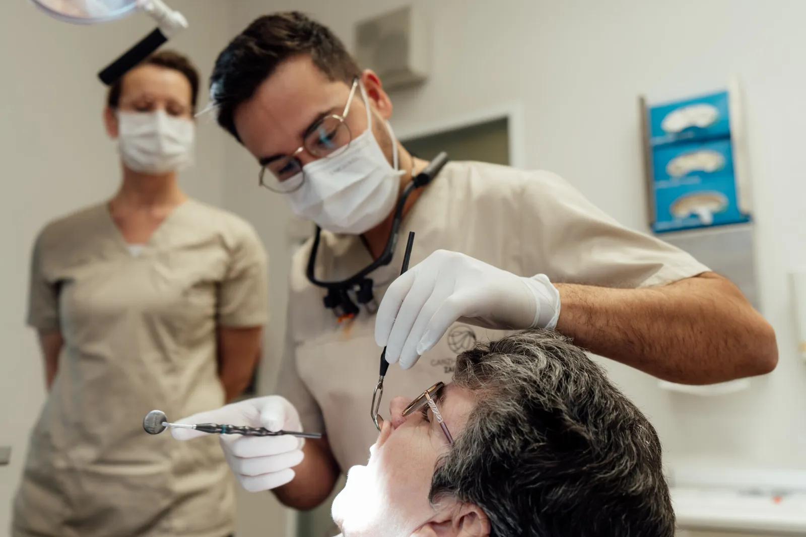Holistic dentist examining a patient's jaw and bite at the practice in Bad Schwartau