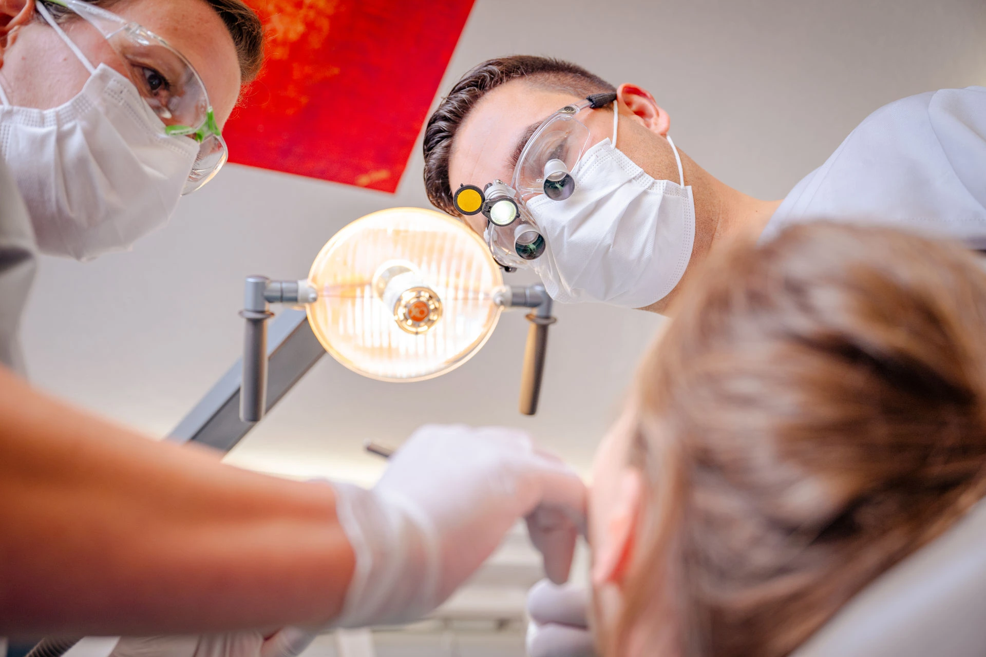 Treatment in progress under loupes in the practice